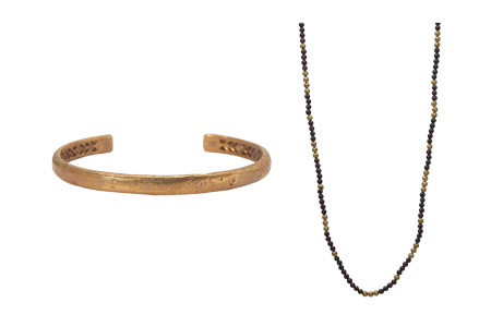 A brass cuff and brass and garnet bead necklace, both by John Varvatos, available at Morgan’s Jewelers.